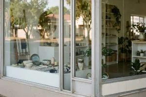 A tidy shopfront window with clean glass, representing a reopened local business.